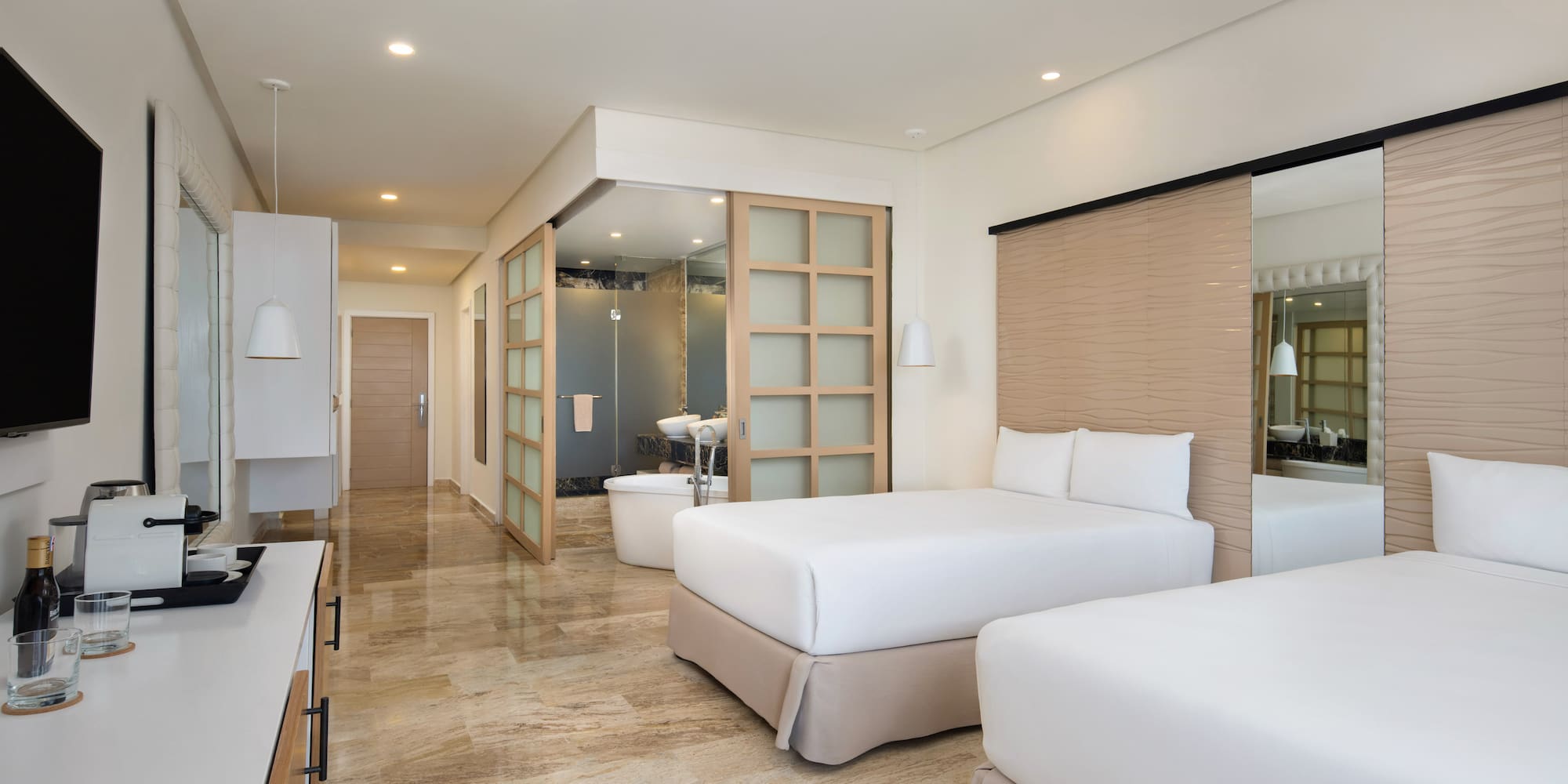 a hotel room with two beds