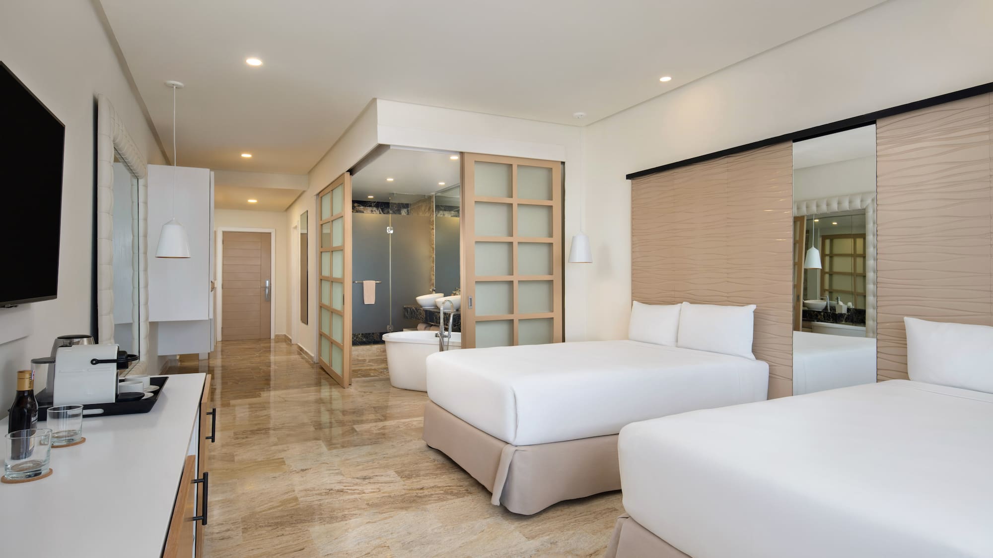 a hotel room with two beds