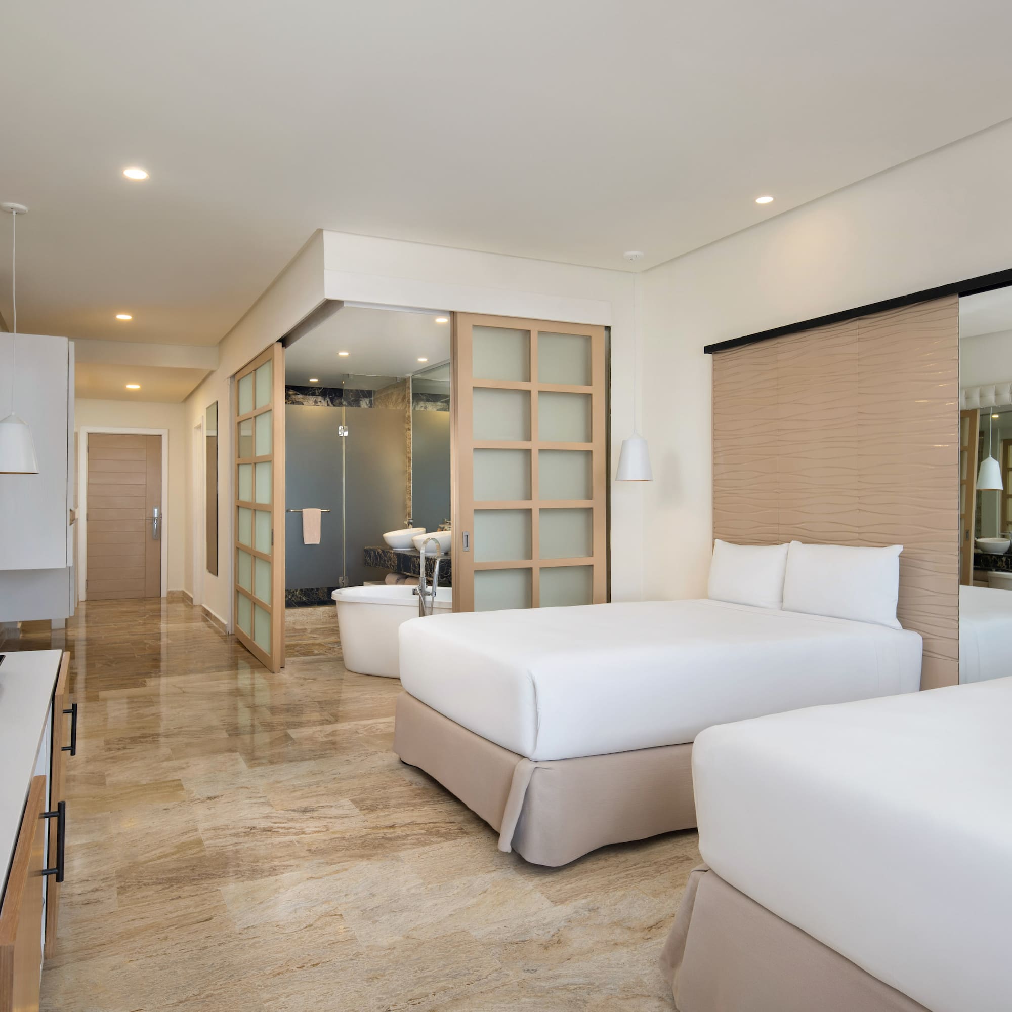 a hotel room with two beds