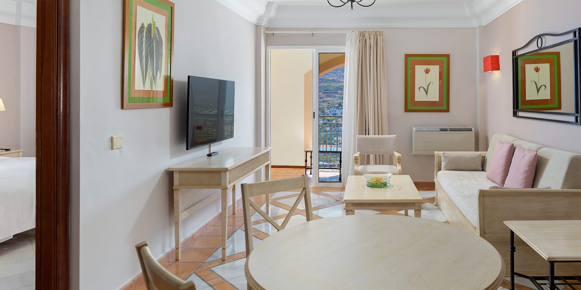 a living room with a television and a table