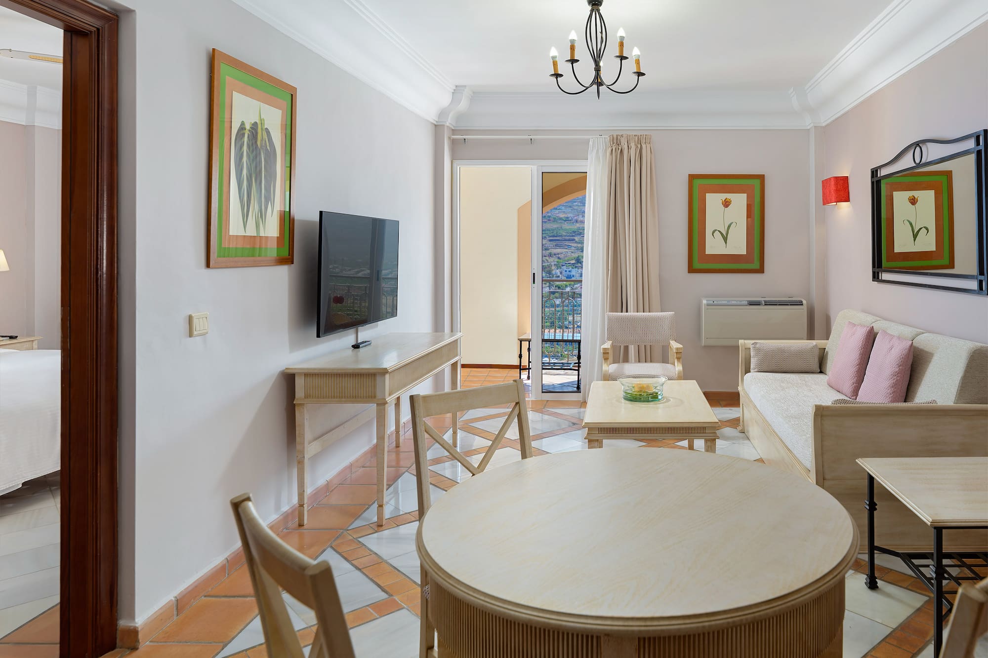 a living room with a television and a table