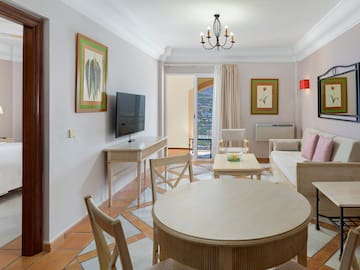 a living room with a television and a table