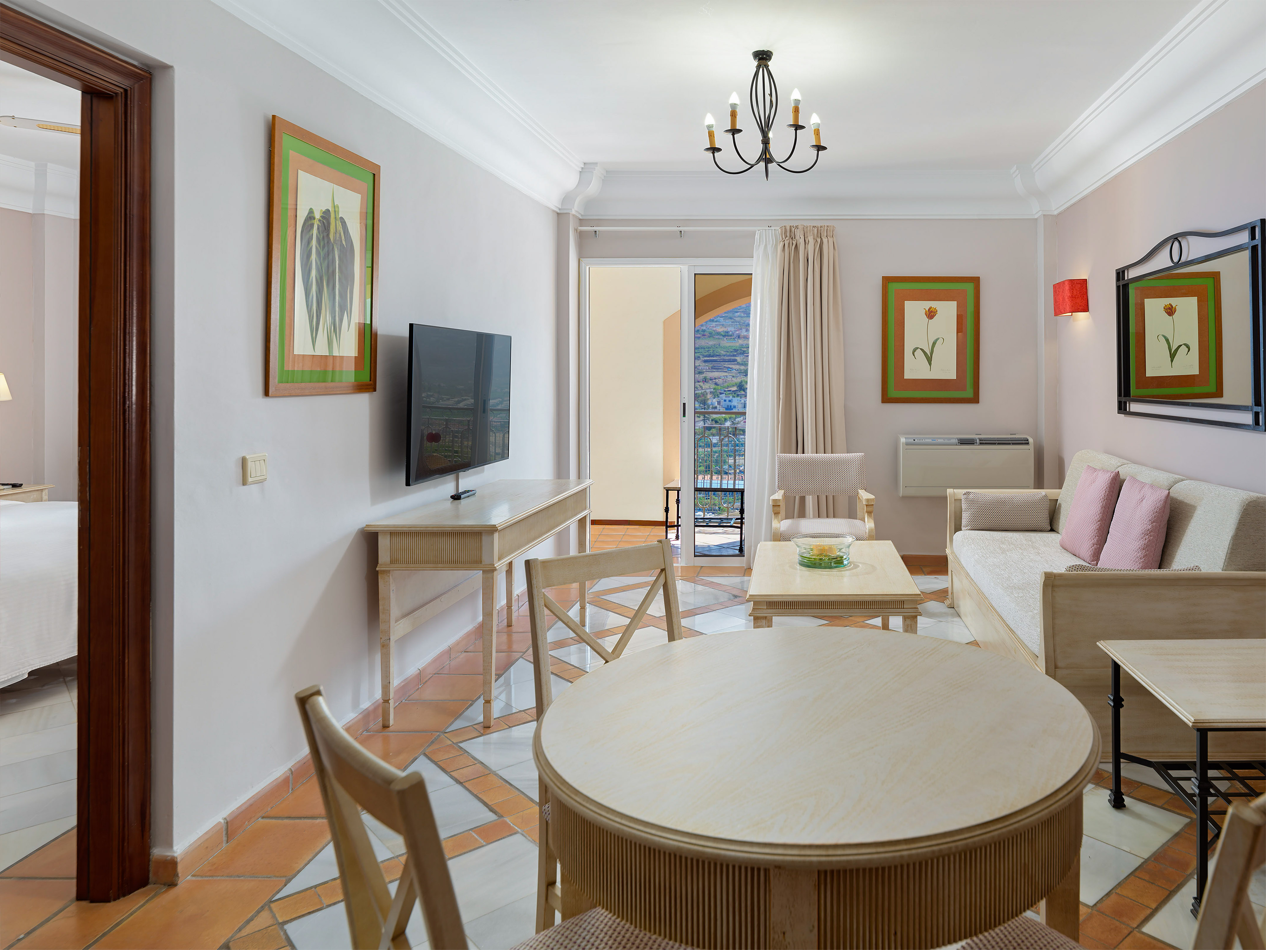 a living room with a television and a table
