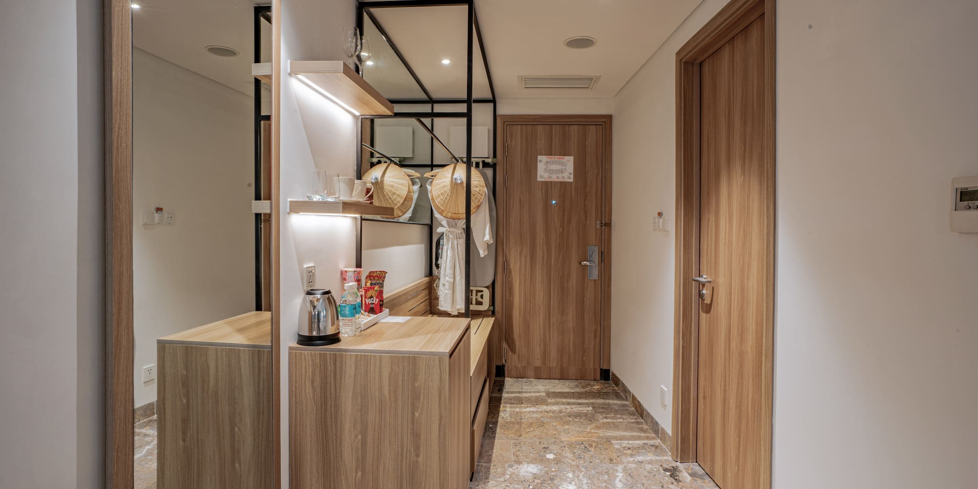 a room with a mirror and a counter