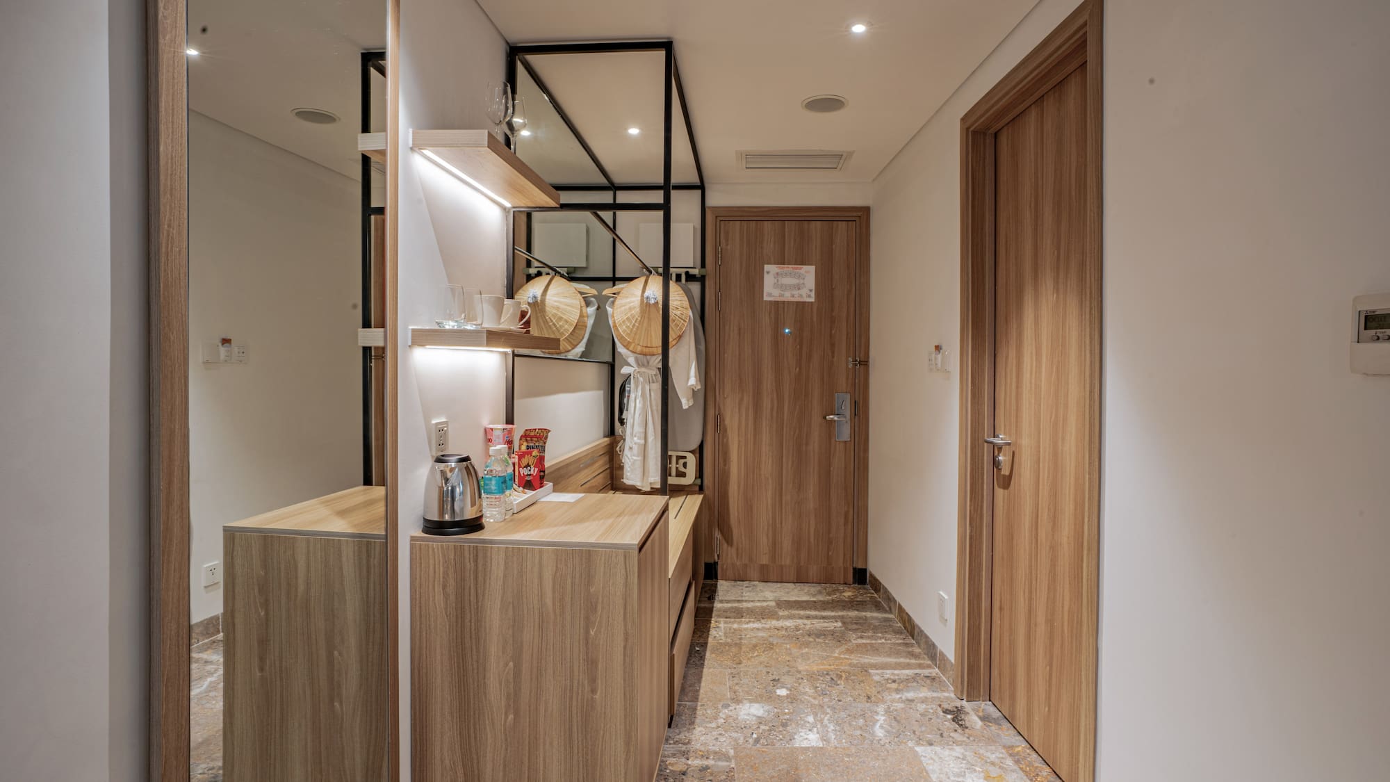 a room with a mirror and a counter