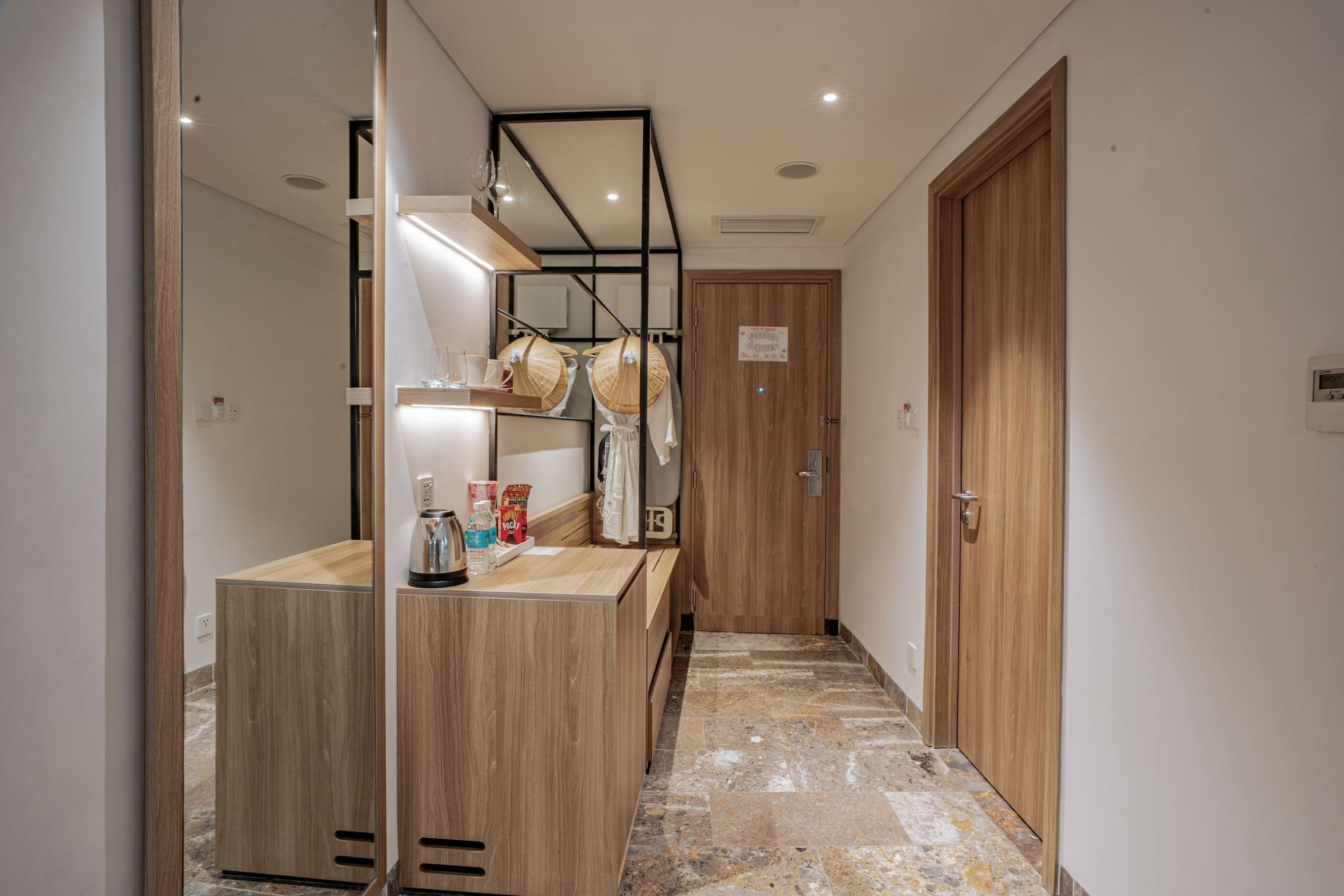 a room with a mirror and a counter