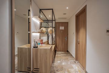 a room with a mirror and a counter