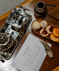 a tray of cookies and a paper on a table