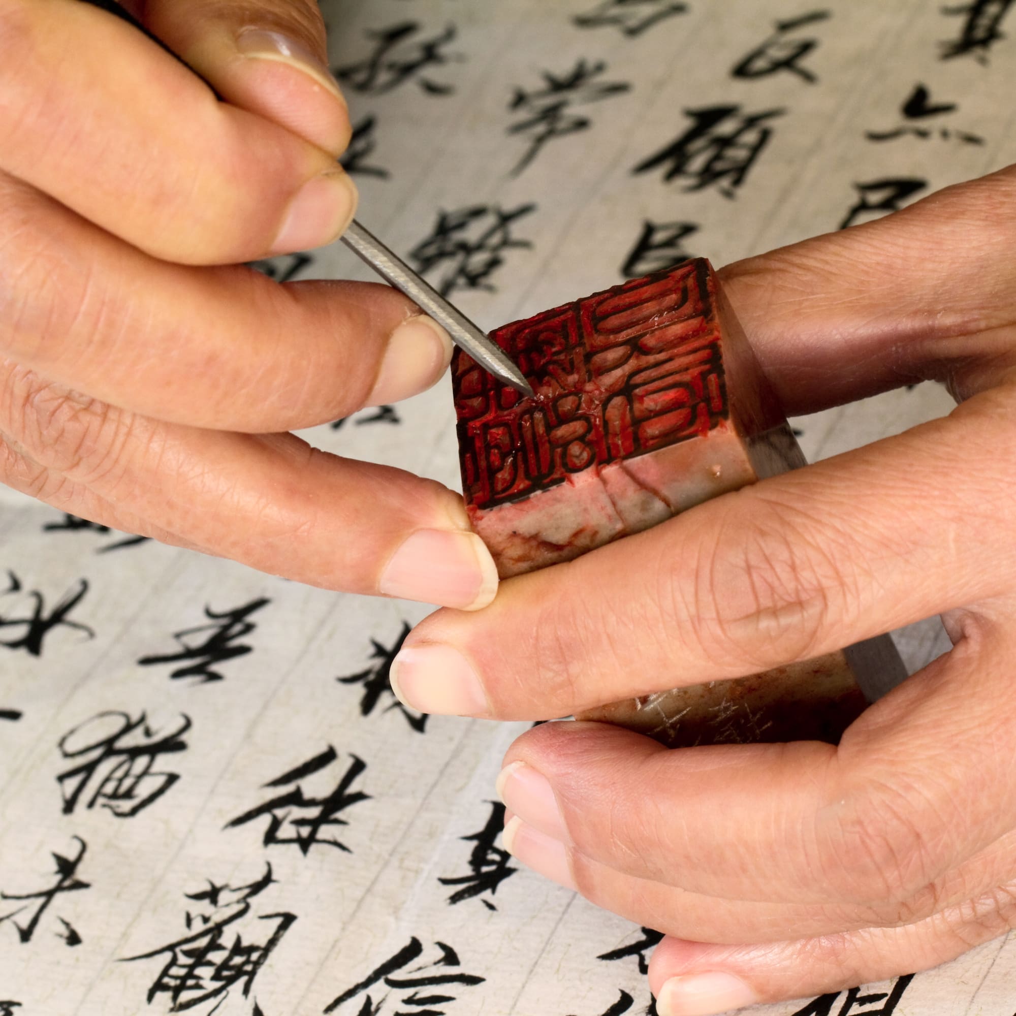 a person using a stamp to seal something