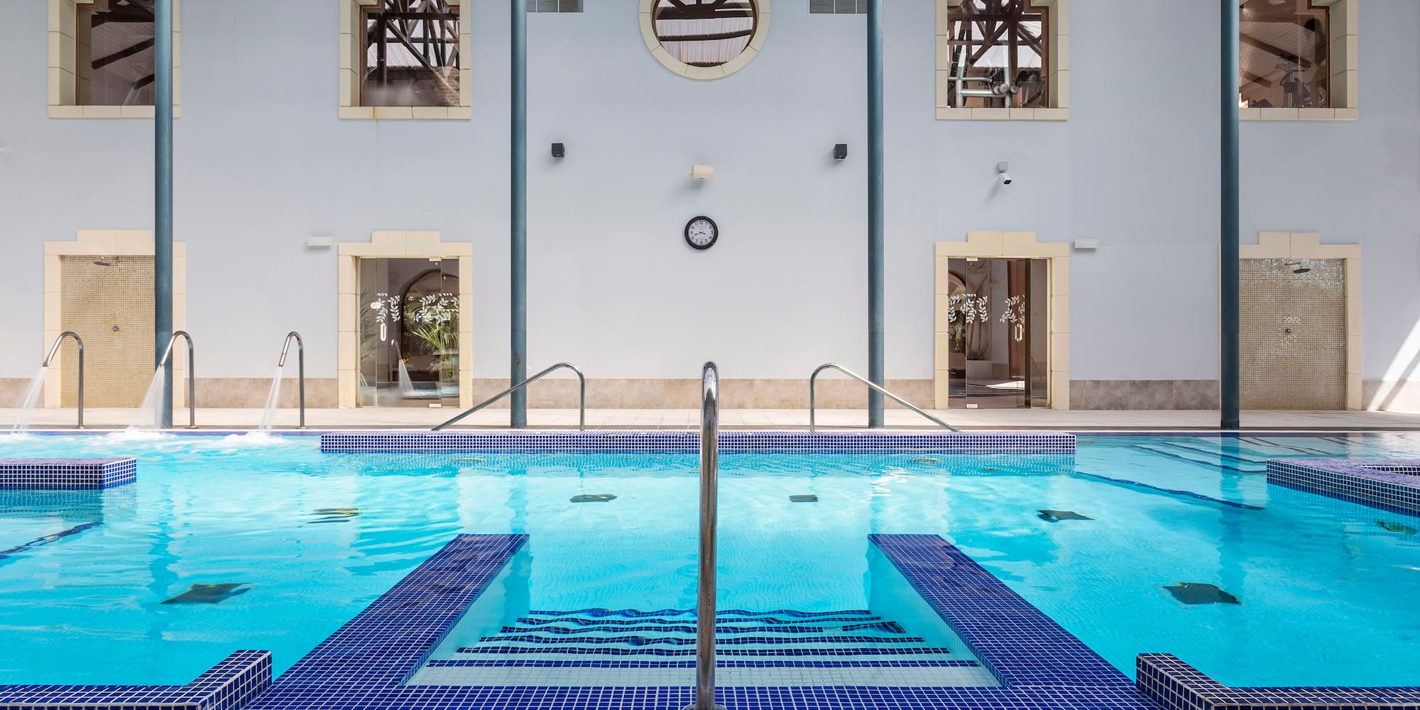 a swimming pool with stairs and steps