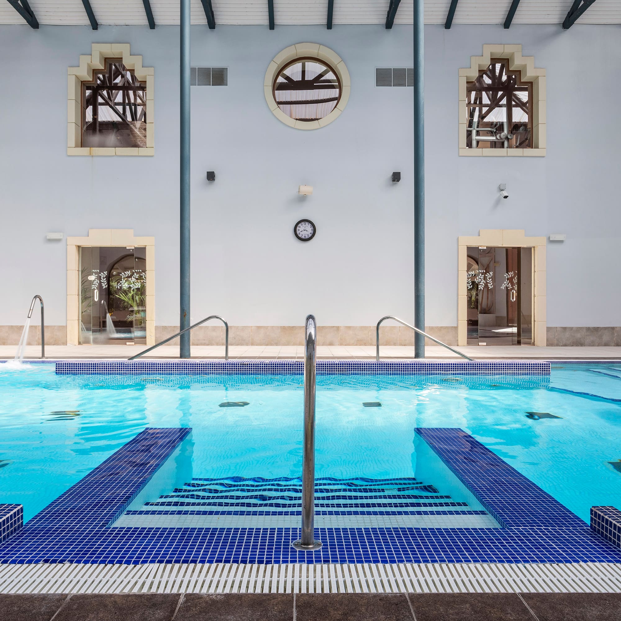 a swimming pool with stairs and steps