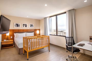 a room with a bed and a desk