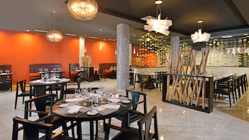 a restaurant with tables and chairs