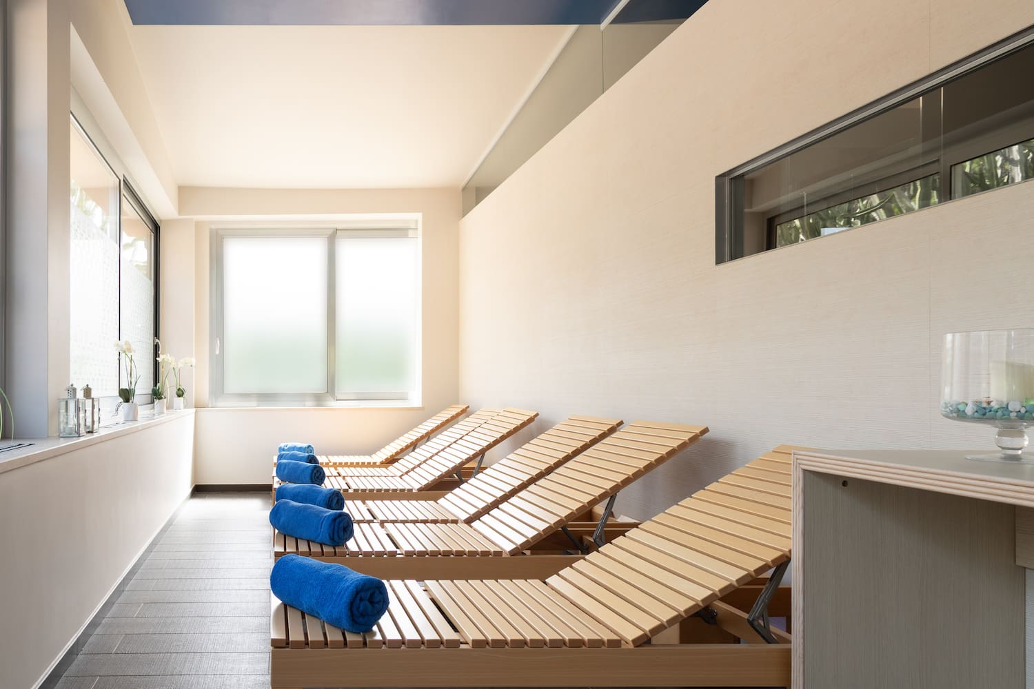 a row of lounge chairs in a room
