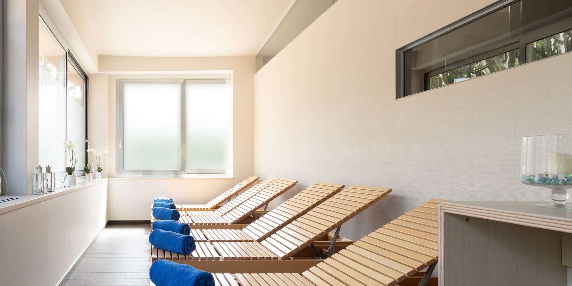 a row of lounge chairs in a room