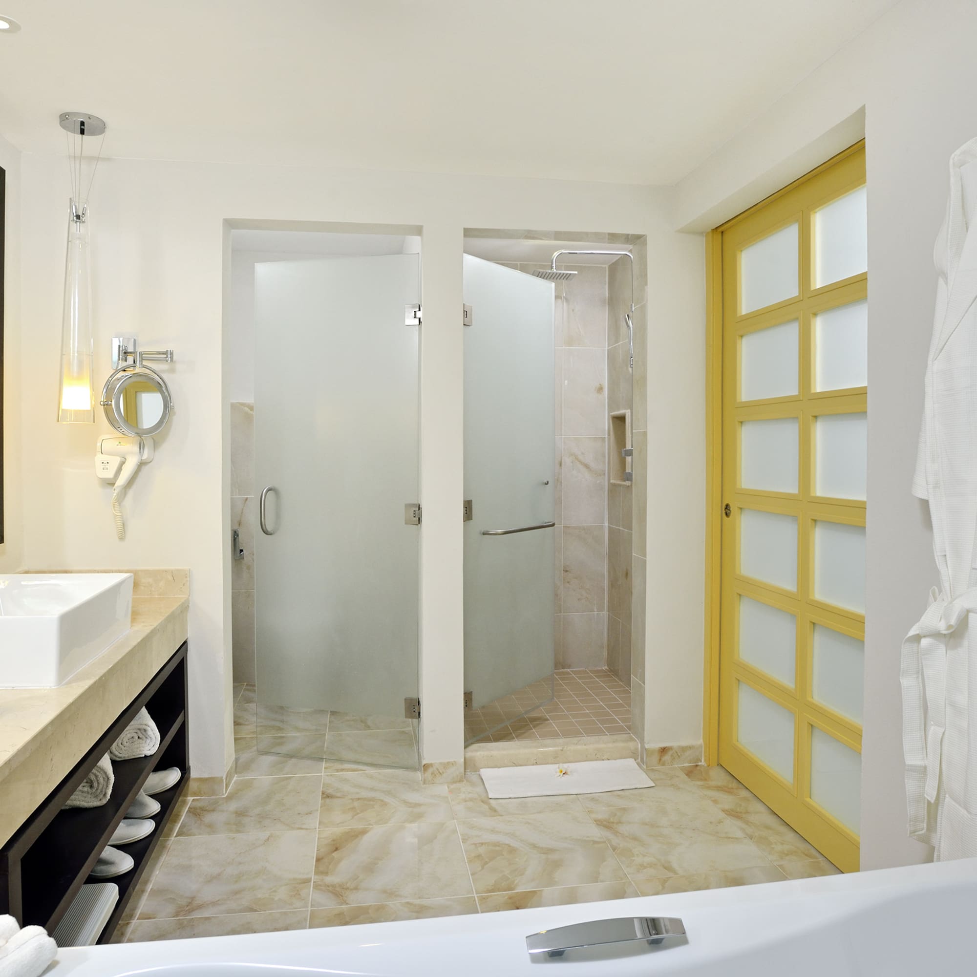 a bathroom with a bathtub and shower