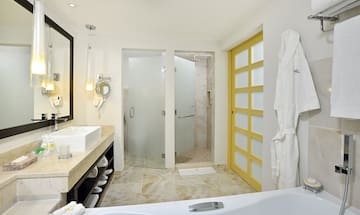 a bathroom with a bathtub and shower