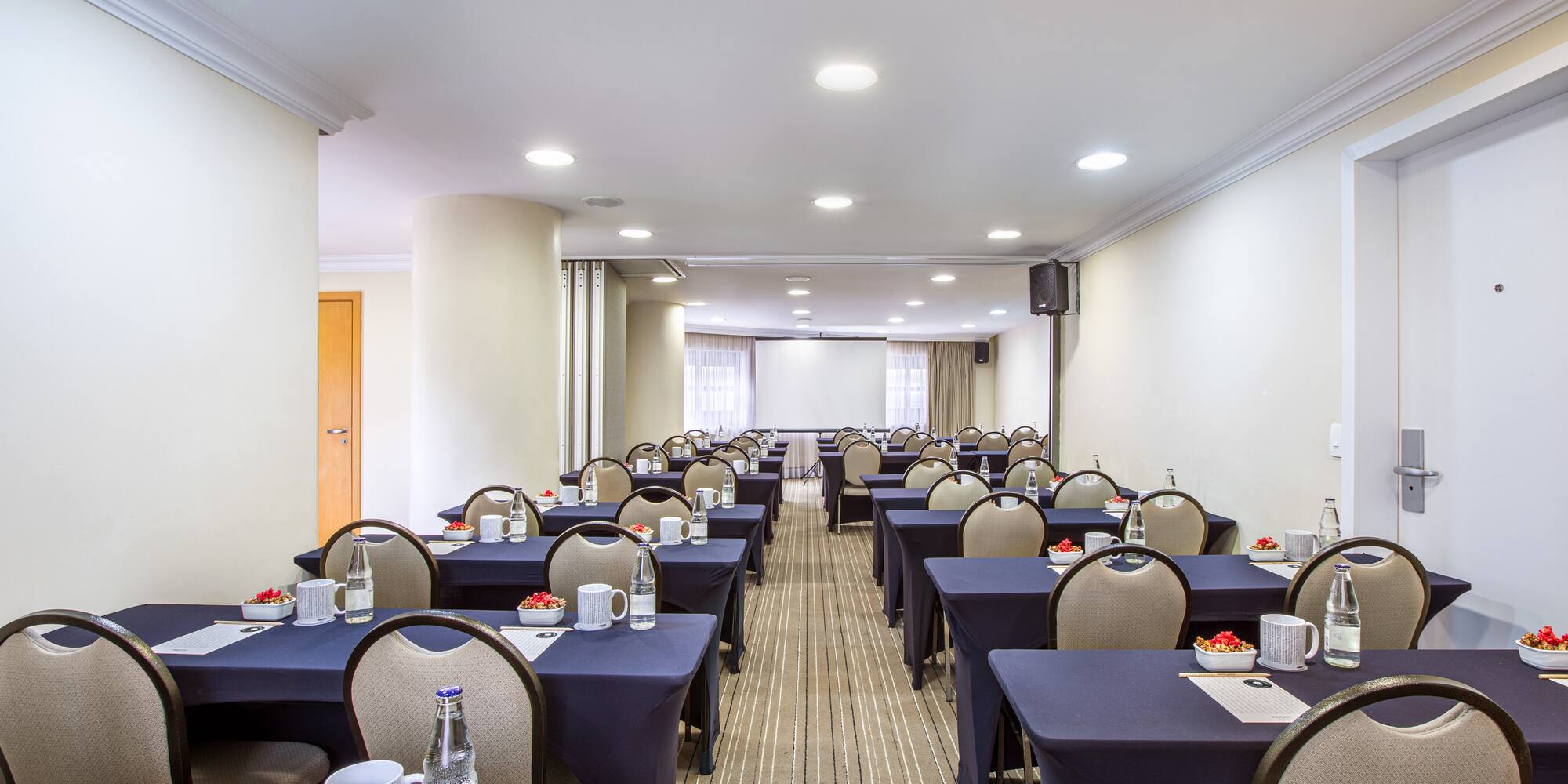 a room with tables and chairs