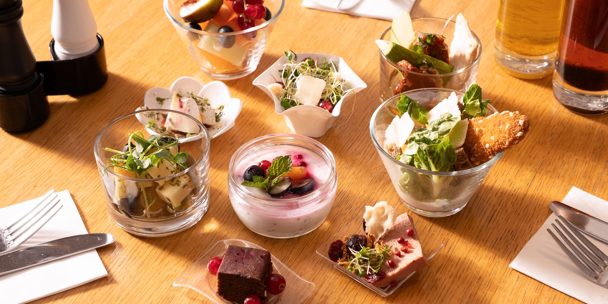 a table with small bowls of food