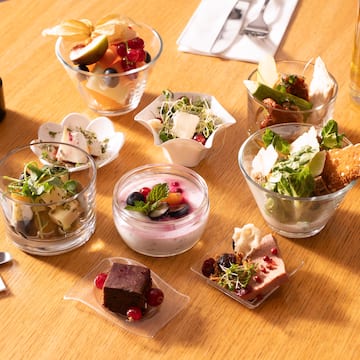 a table with small bowls of food