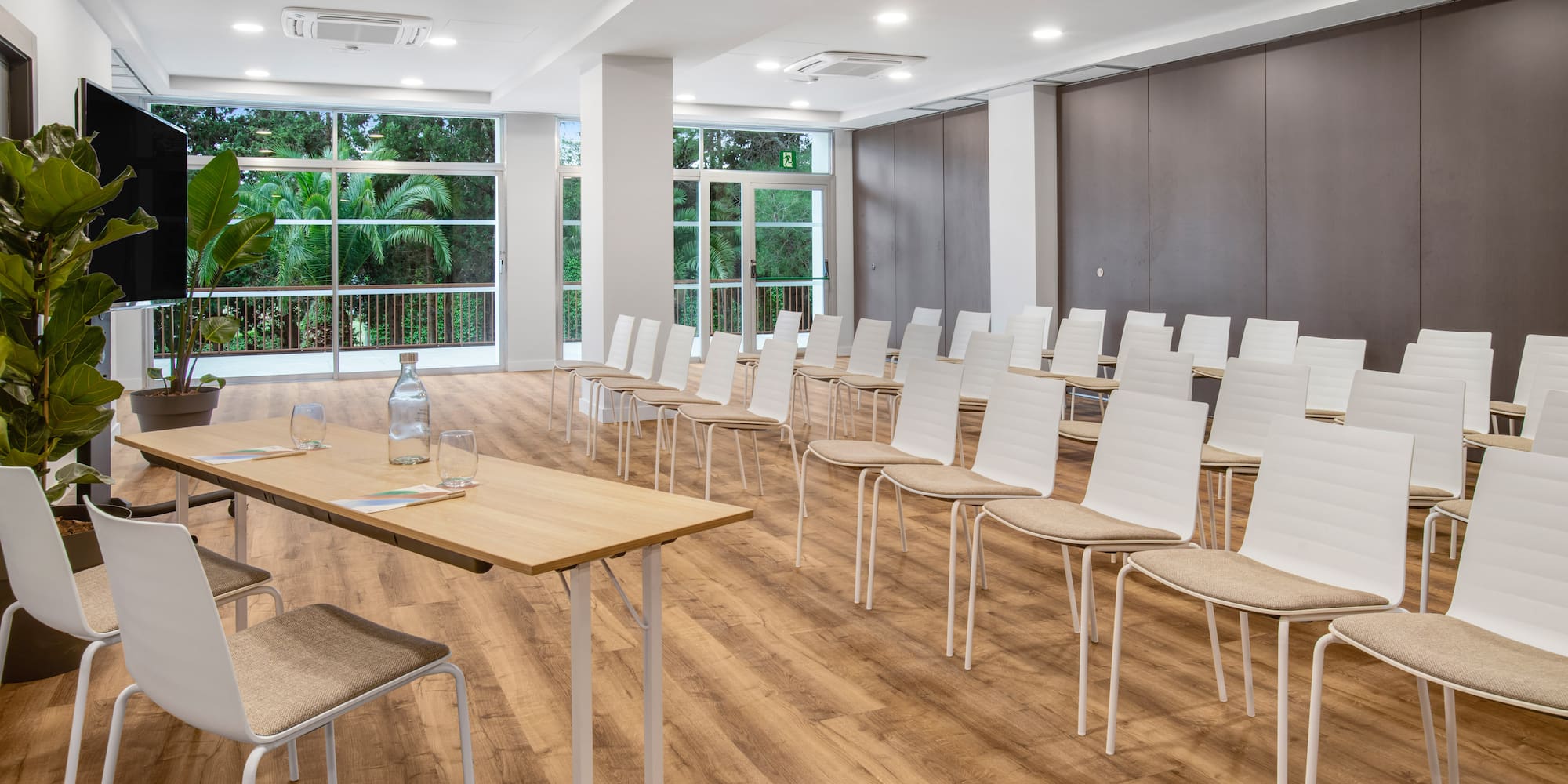 a room with many chairs and tables