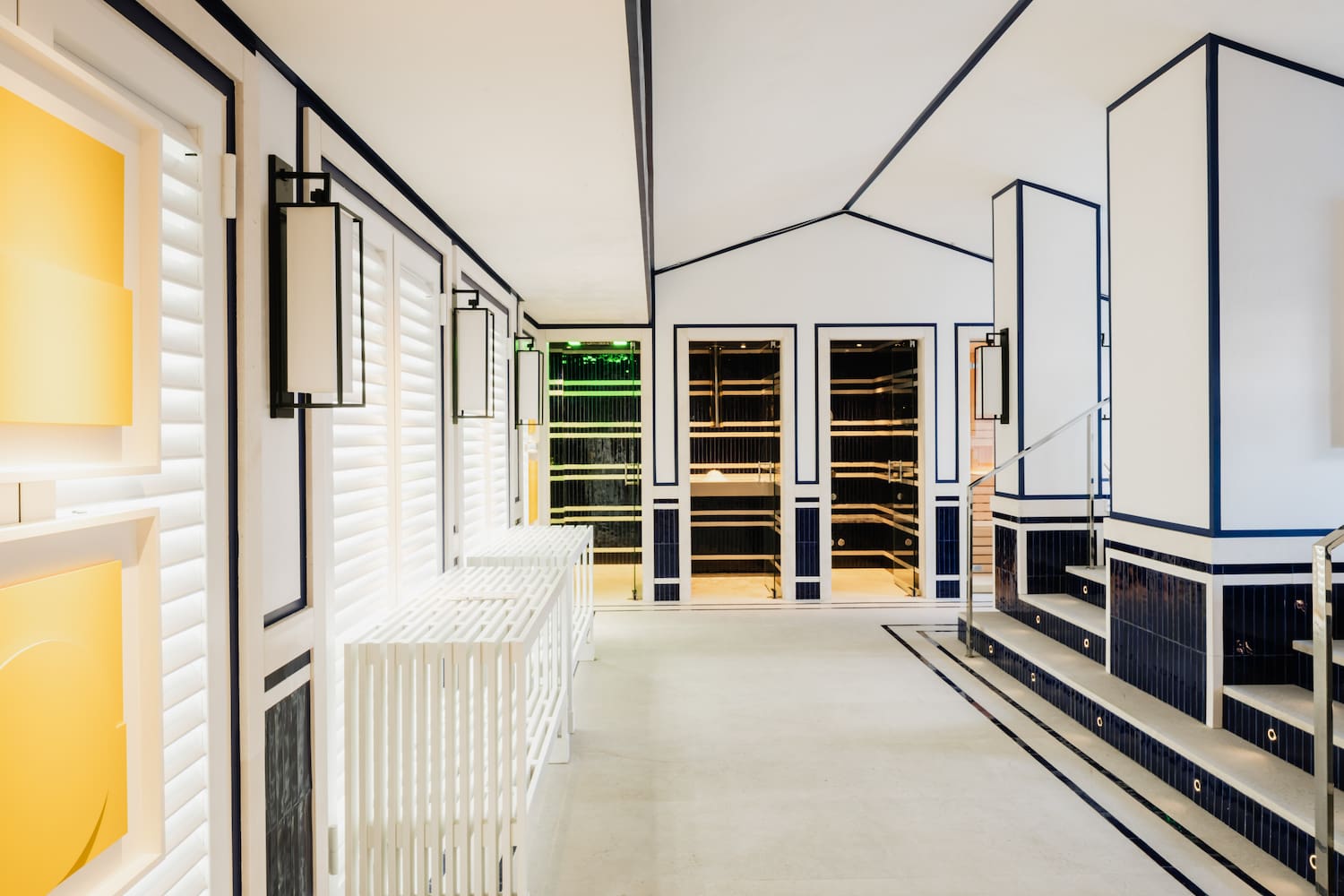 a white and blue room with stairs and white walls