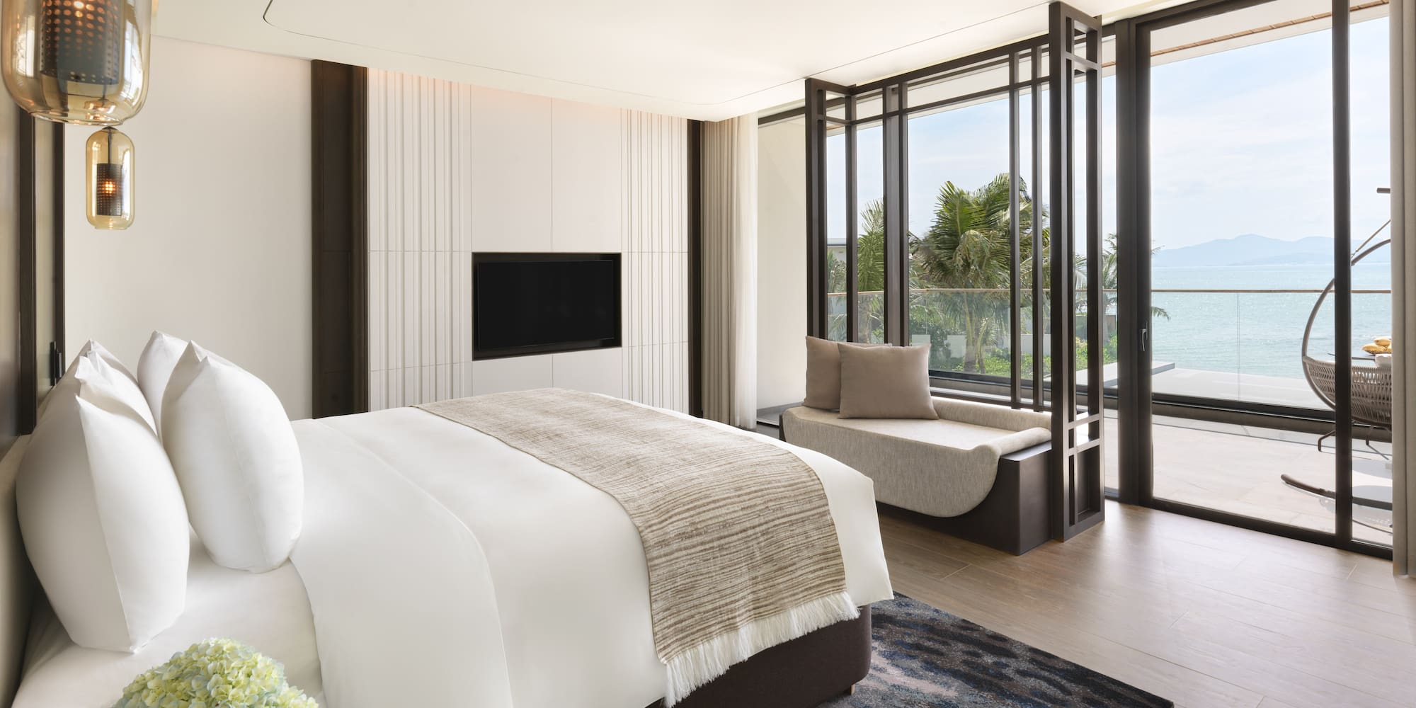 a bedroom with a bed and a tv