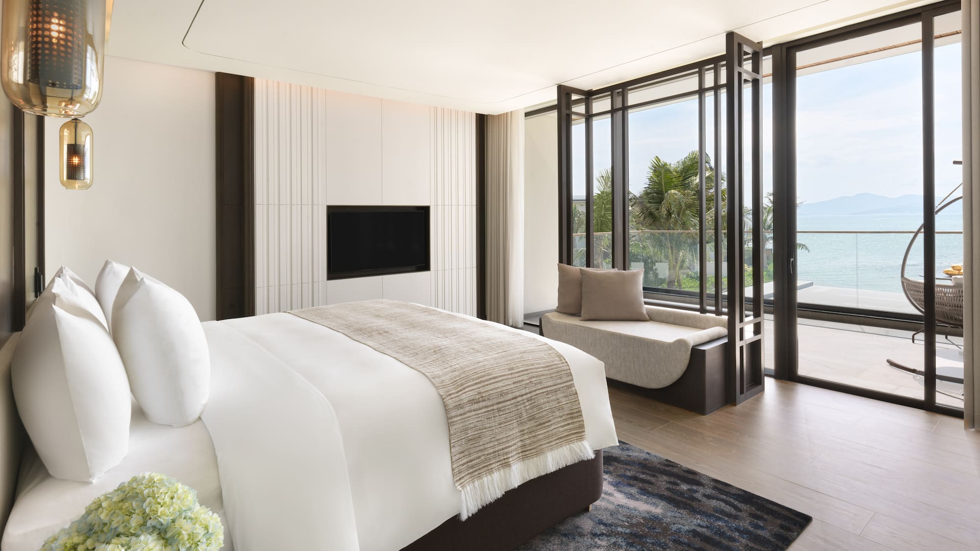 a bedroom with a bed and a tv