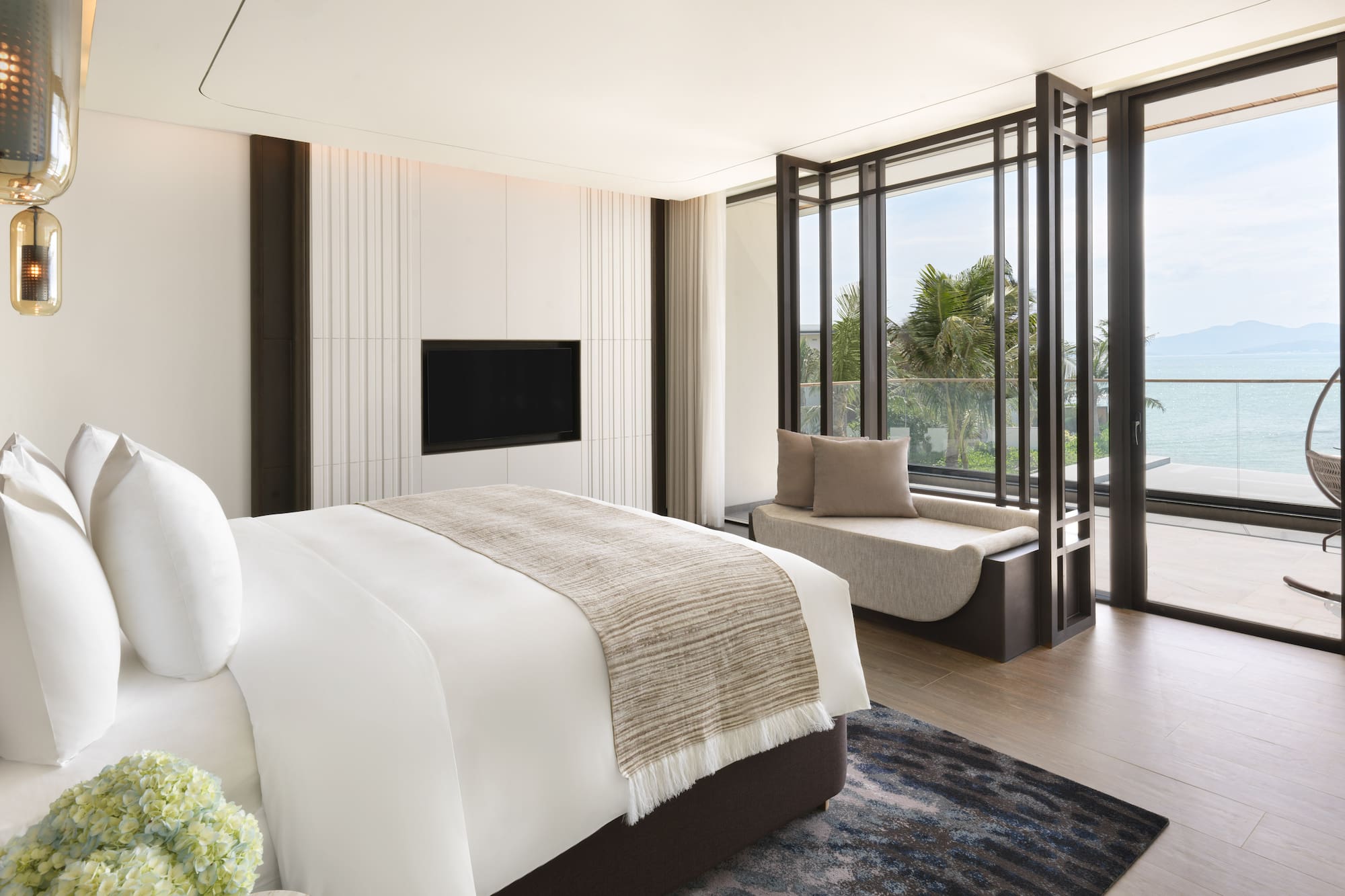 a bedroom with a bed and a tv