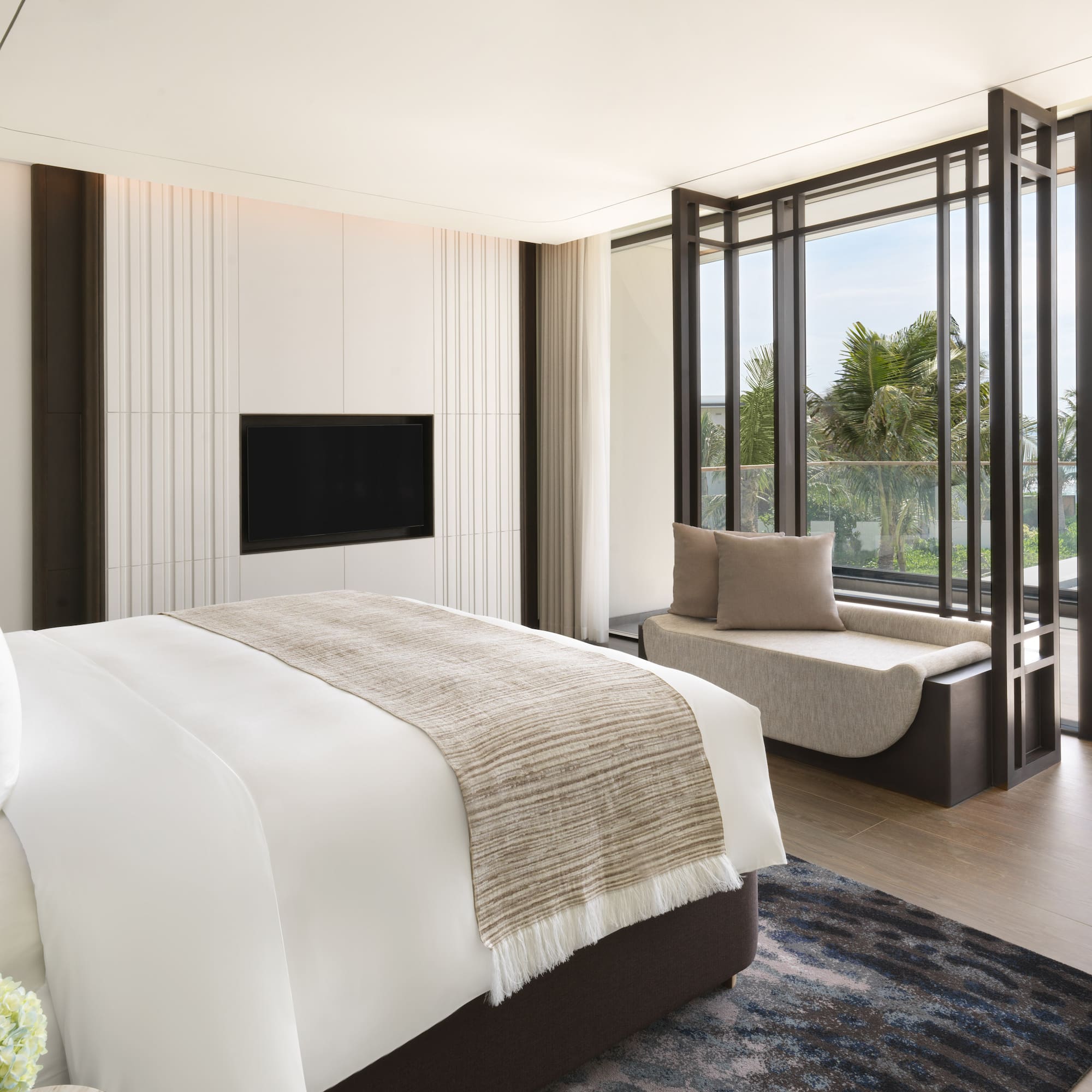 a bedroom with a bed and a tv