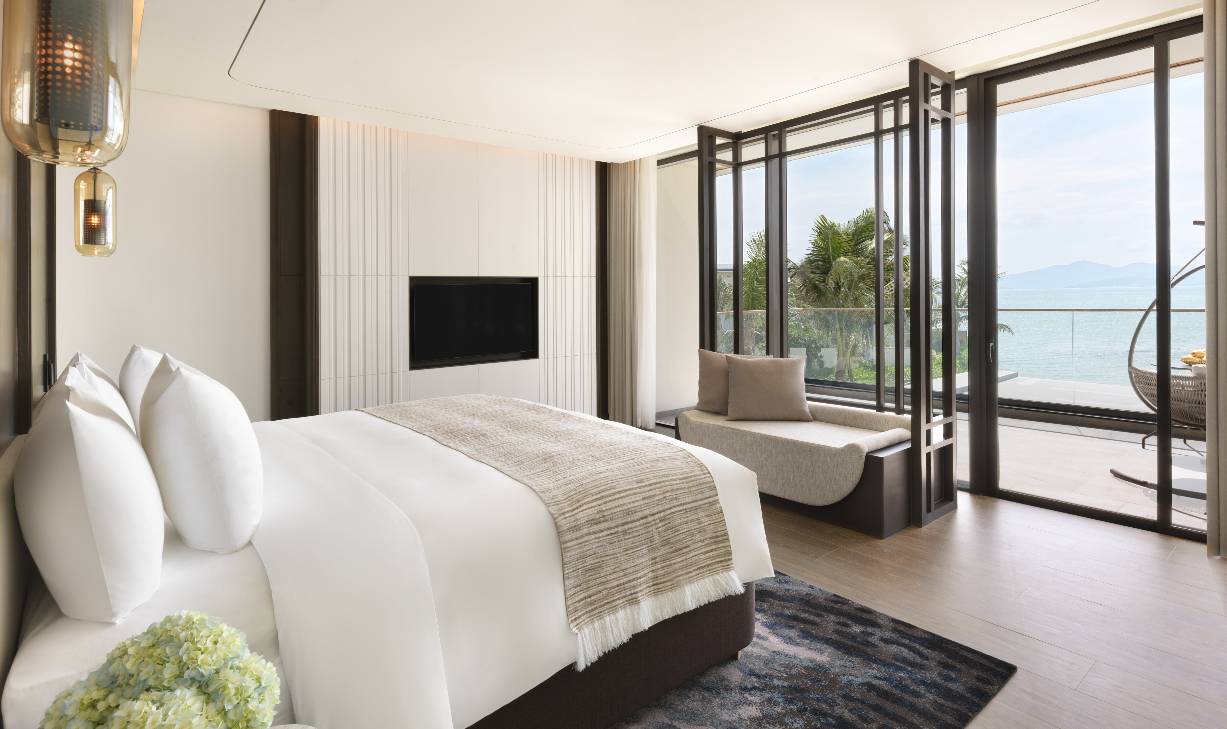 a bedroom with a bed and a tv