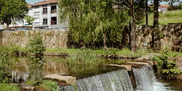 a waterfall over a river