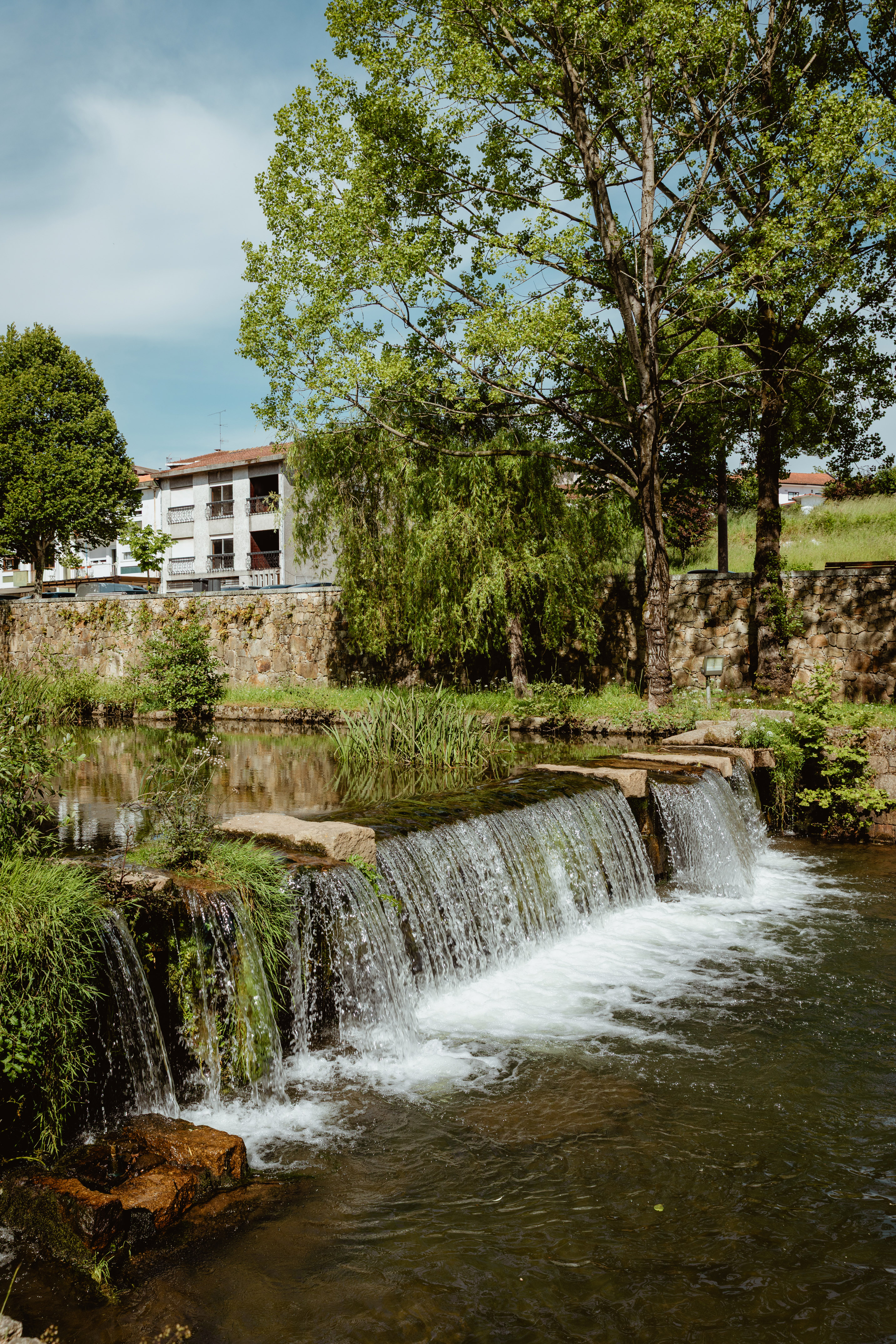 a waterfall over a river