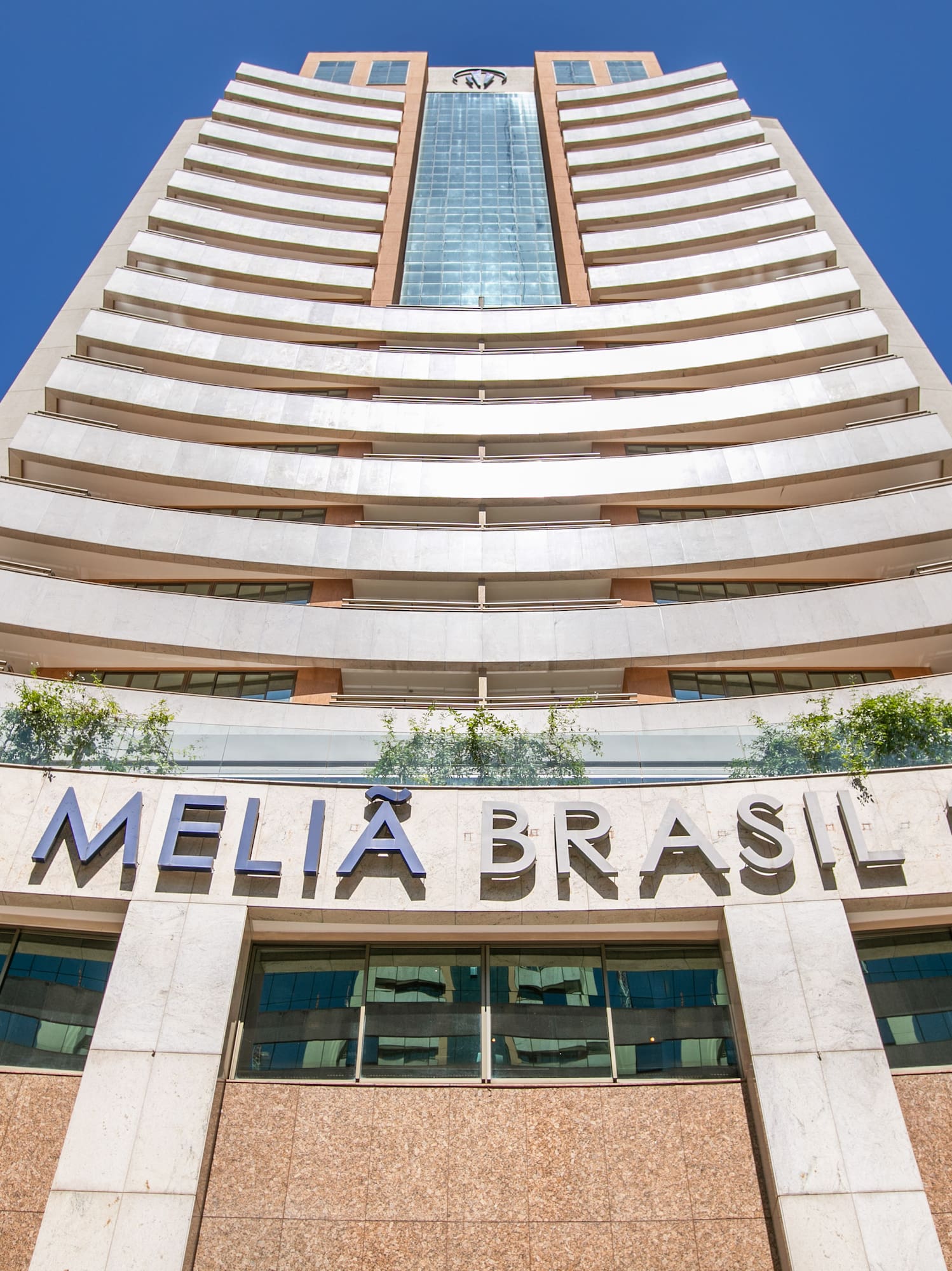 a tall building with a blue sky