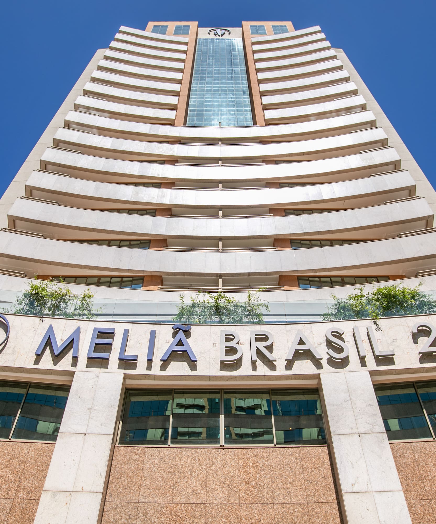 a tall building with a blue sky