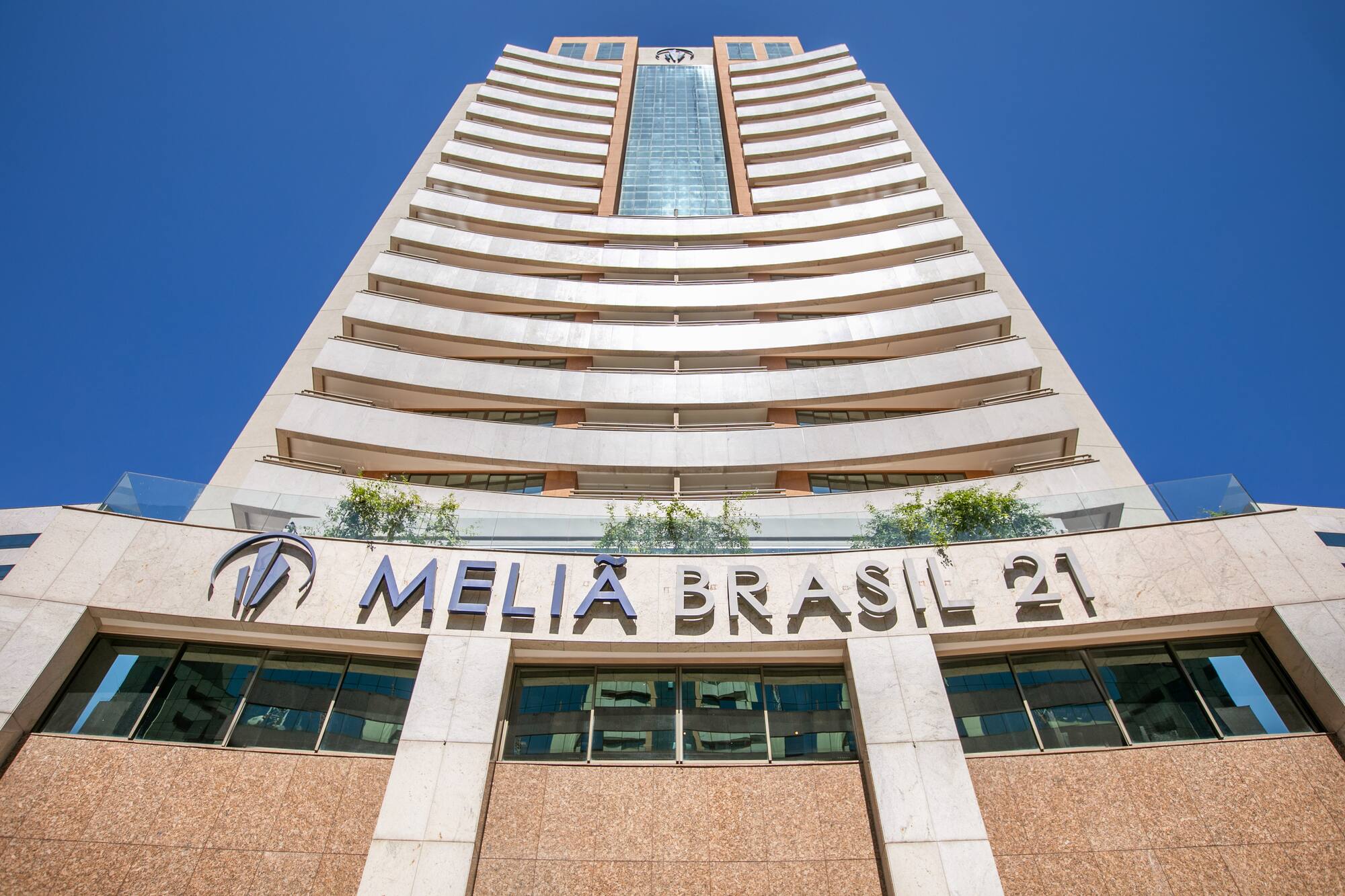 a tall building with a blue sky
