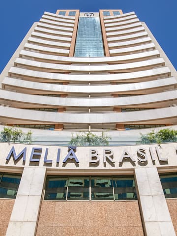 a tall building with a blue sky