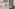 Luxurious Meliá hotel lobby, marble reception desk, intricate floor, staff.