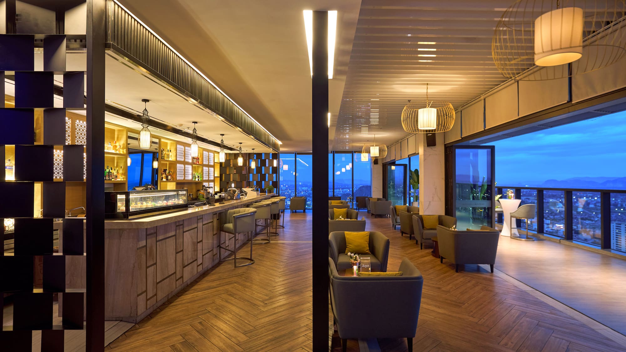 a room with a bar and chairs