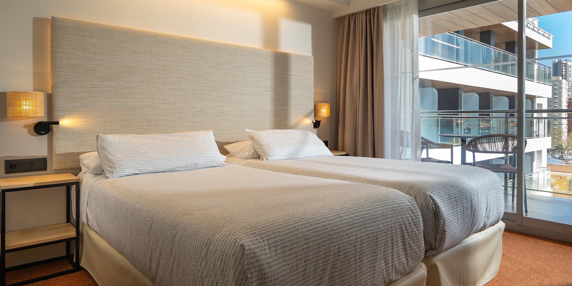 a two beds in a hotel room