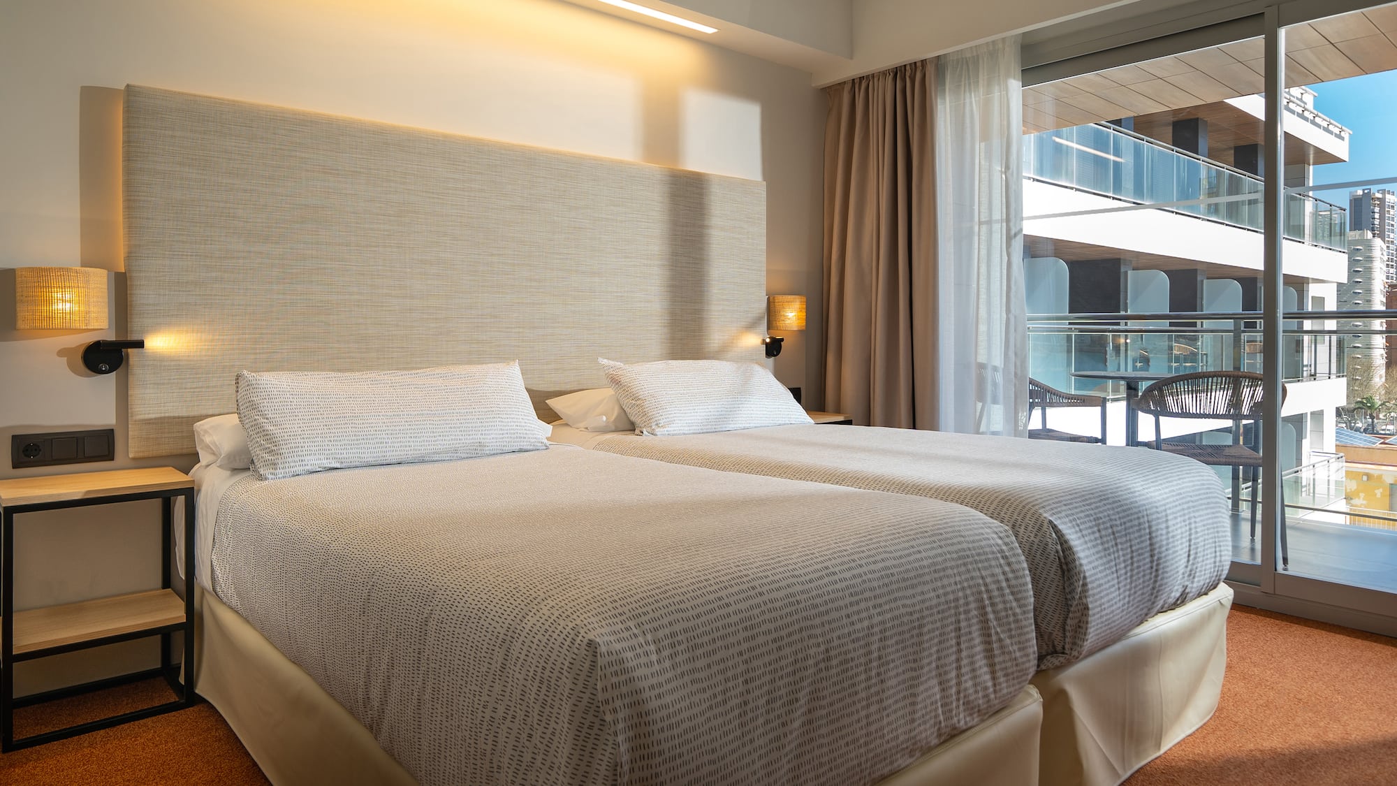 a two beds in a hotel room