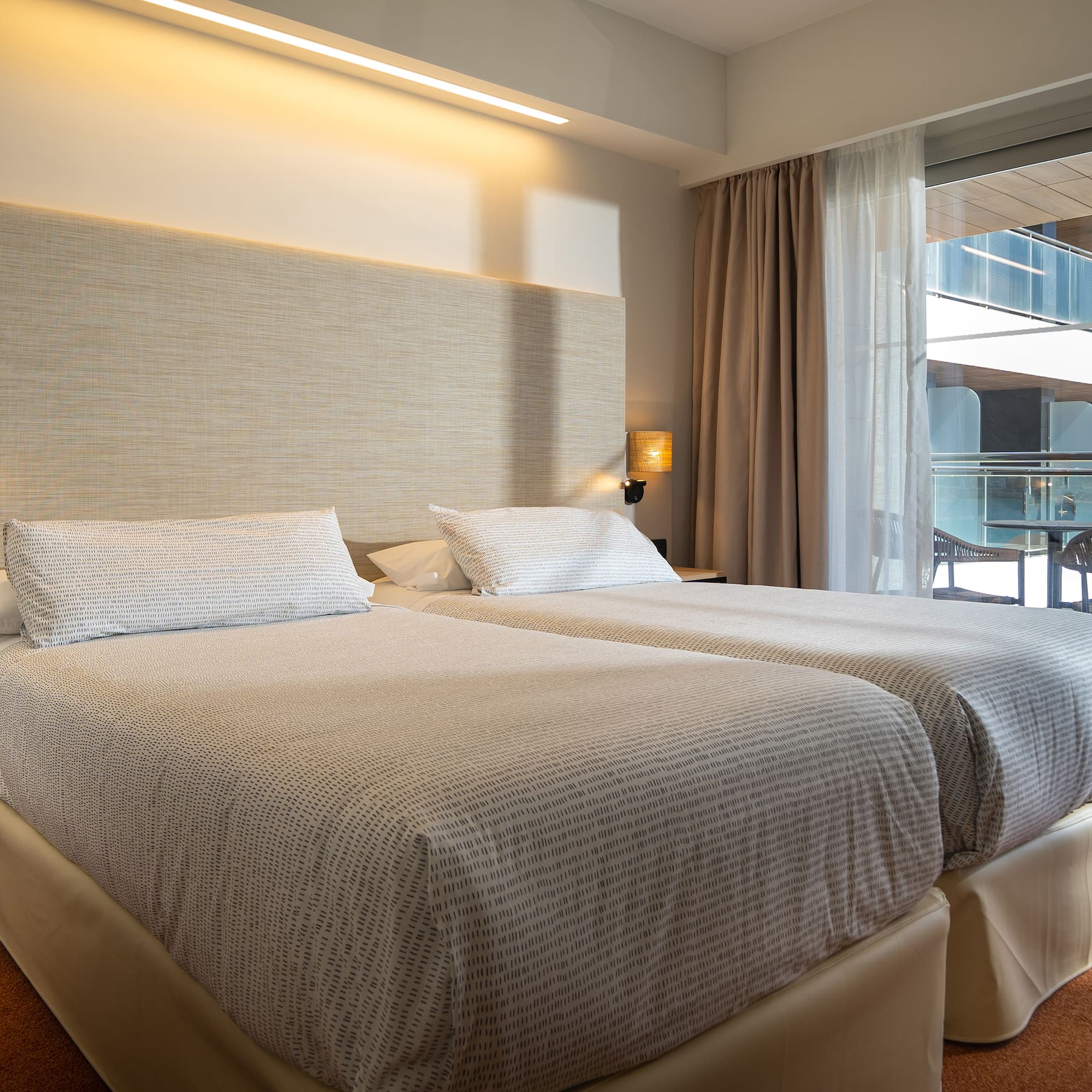 a two beds in a hotel room