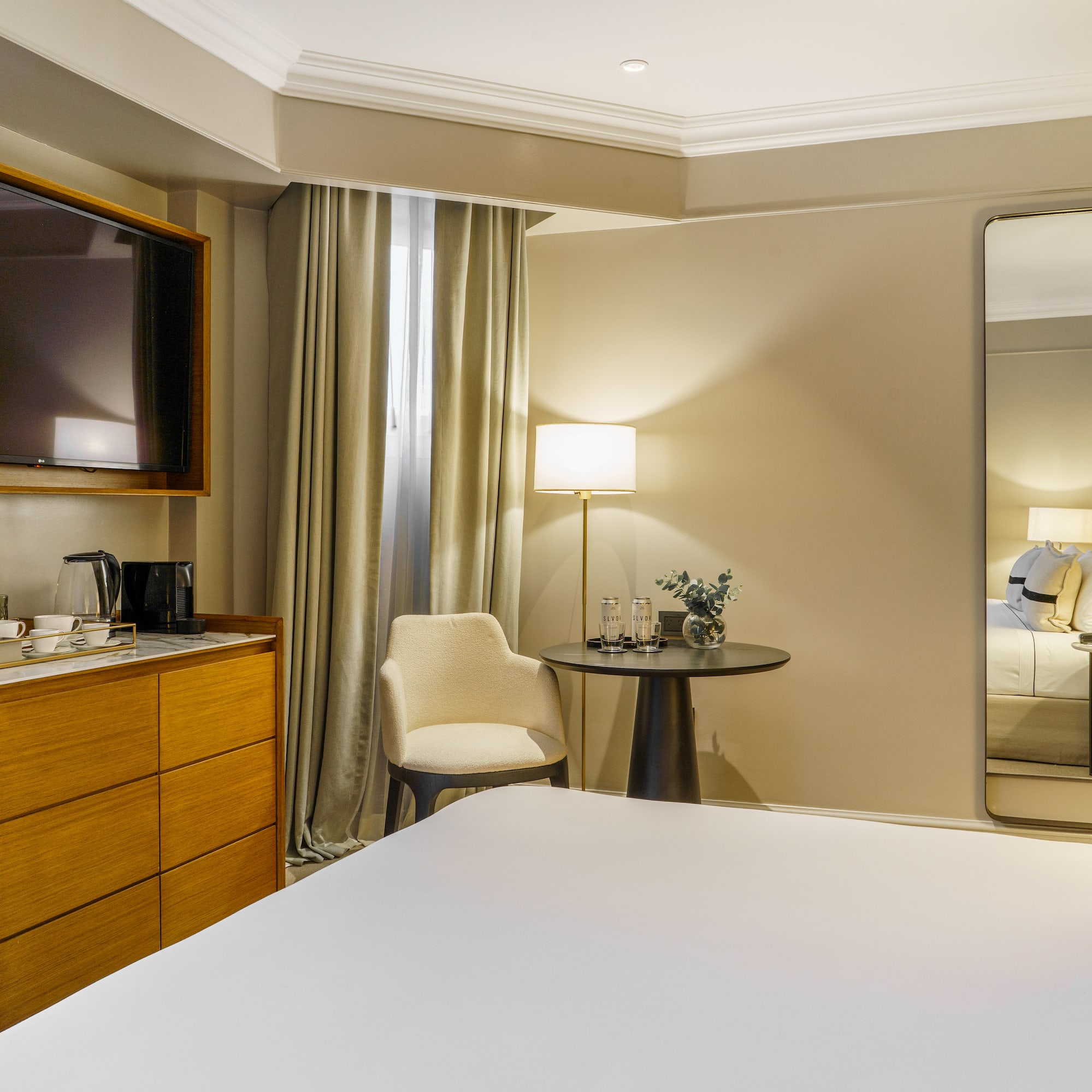 a room with a large mirror and a bed