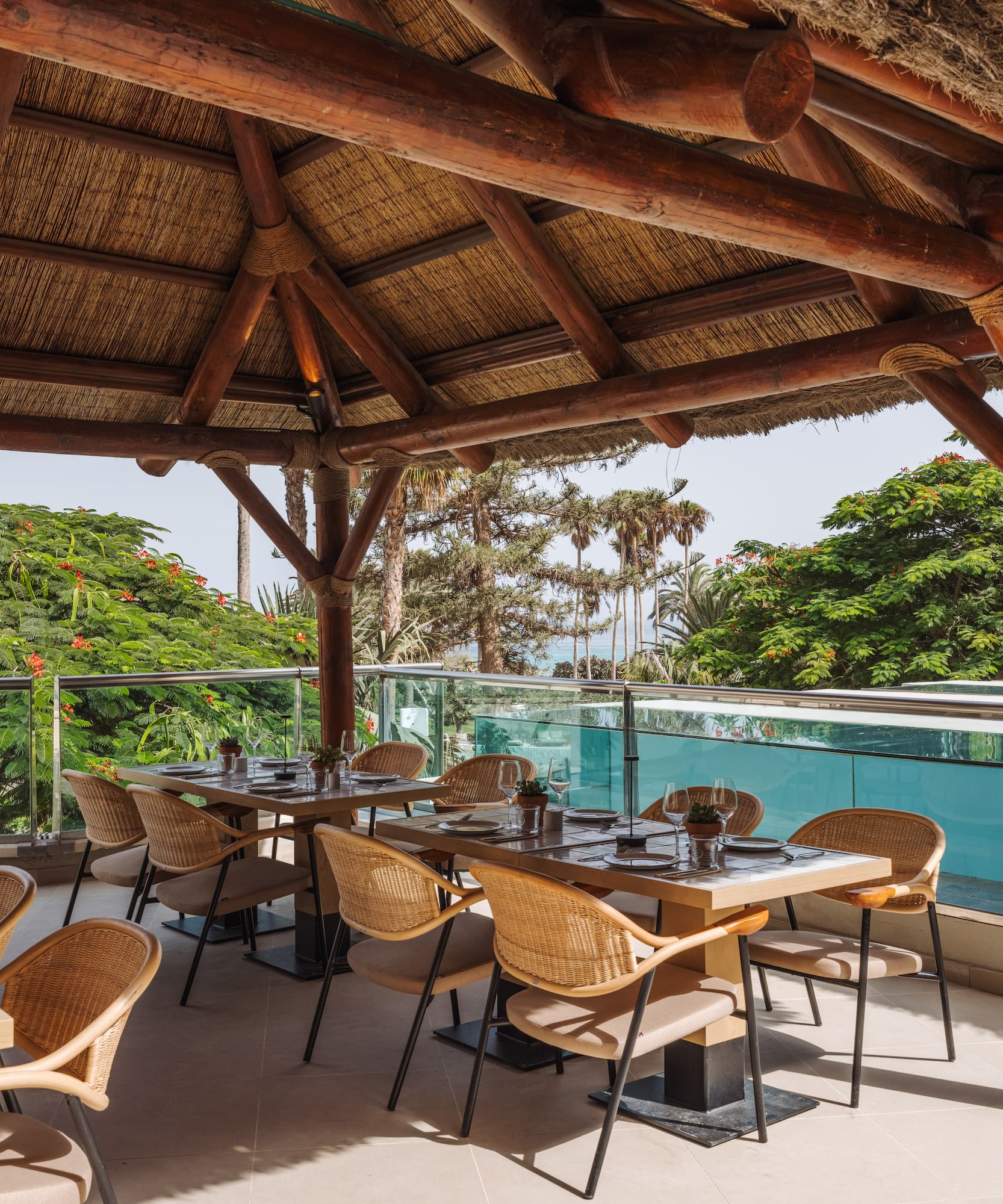a restaurant with a thatched roof