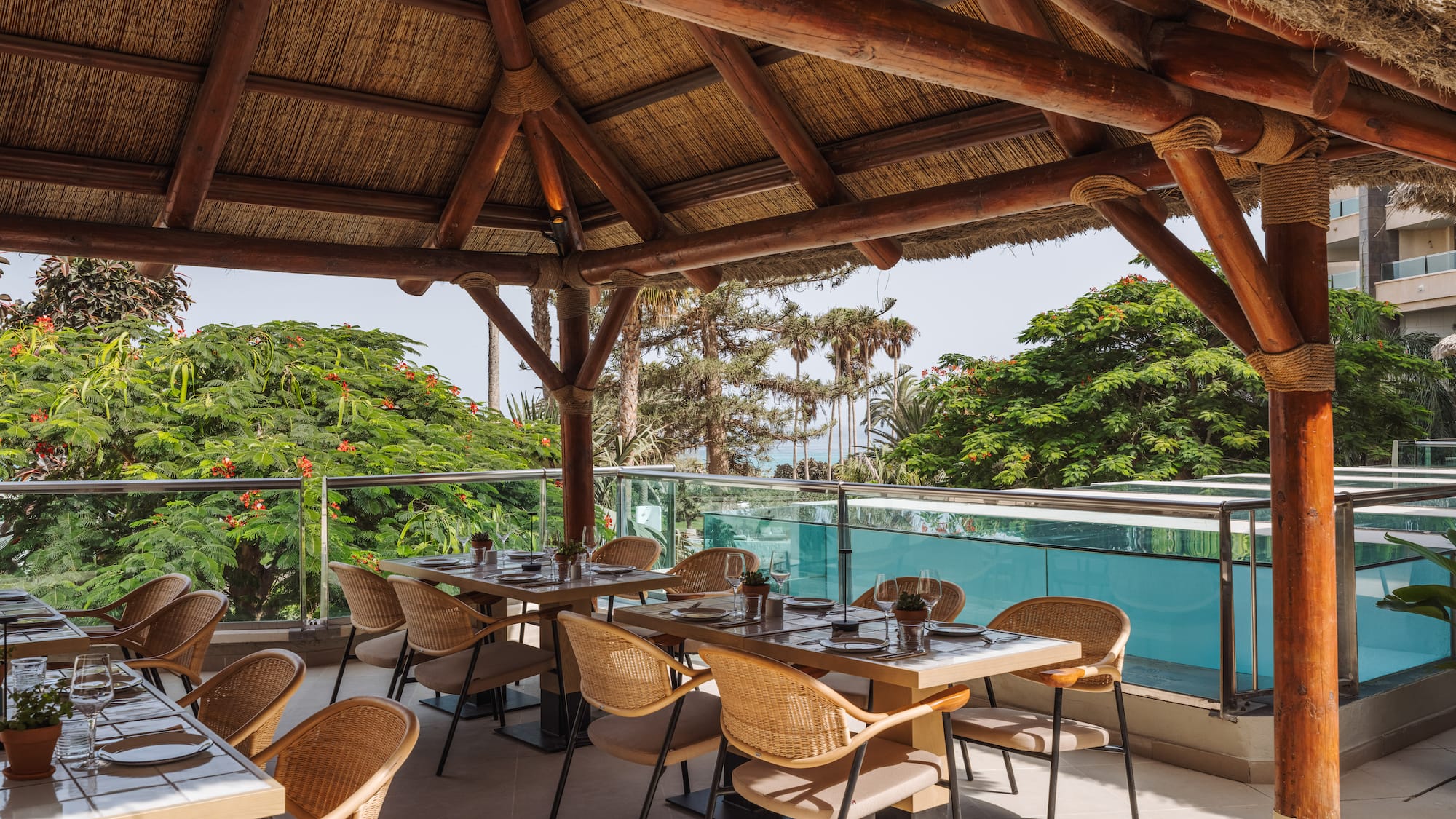 a restaurant with a thatched roof