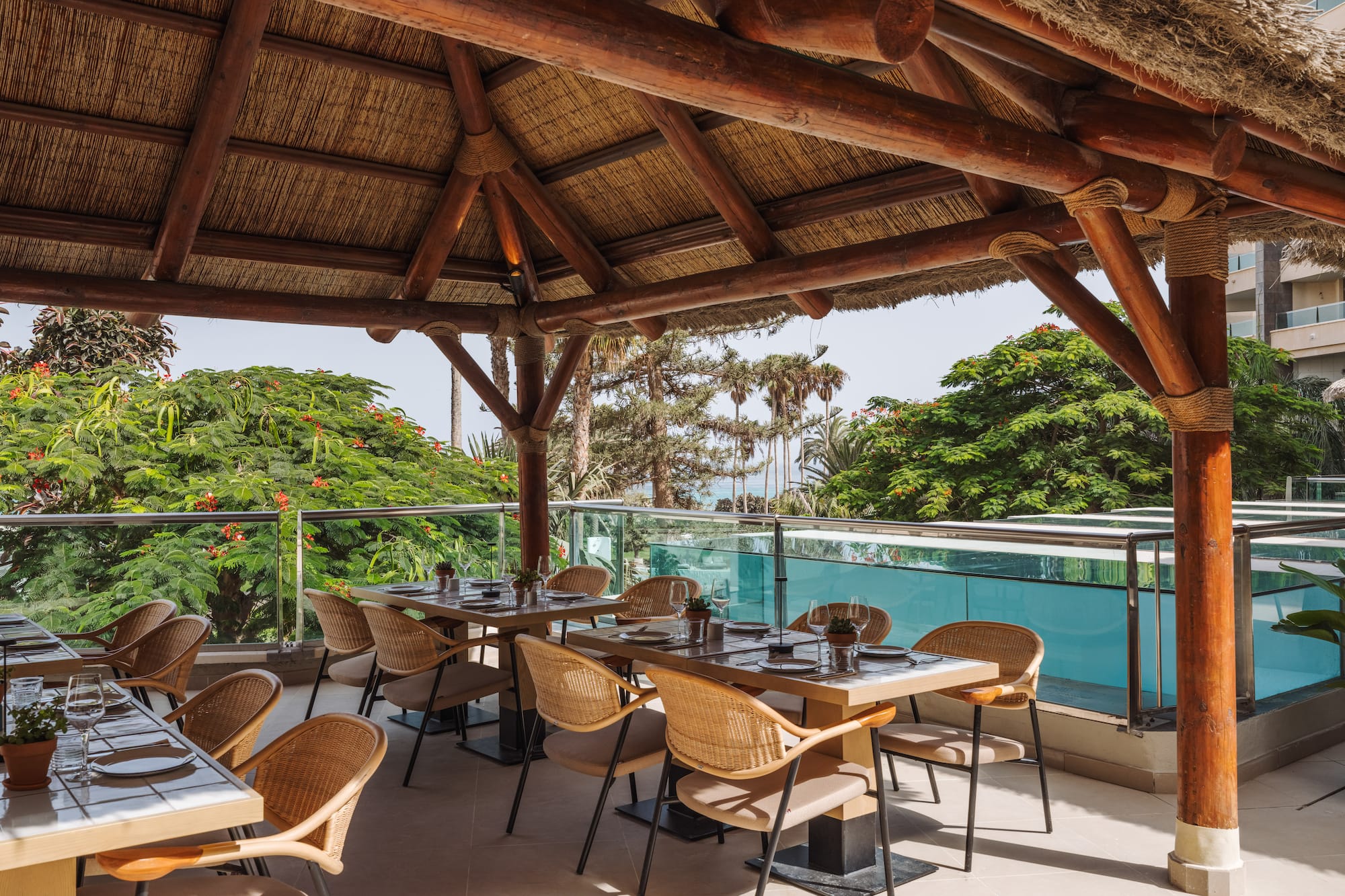 a restaurant with a thatched roof