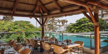 a restaurant with a thatched roof