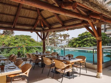 a restaurant with a thatched roof
