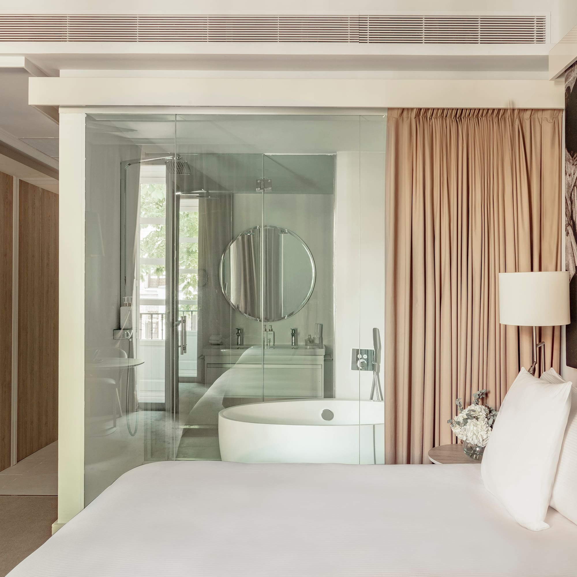 a bed with a tub and a shower