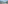 Panoramic view of San Sebastian's La Concha Bay with city, beach, boats.